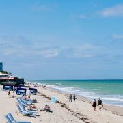 Beachgoers enjoying sunny day in Vero Beach, Florida